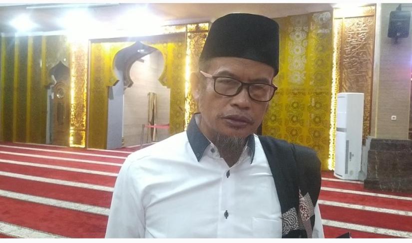 Ustadz Muhammad Syamlan.