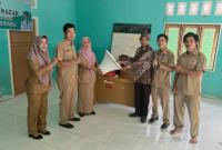 Pelatihan ilmu tajwid serta penyerahan alat penunjang guru TPQ desa talang pungguk 
