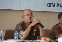 Bupati Gusnan Mulyadi.